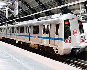 Services were briefly delayed on a section of Delhi Metro's Blue Line after a man allegedly jumped on tracks at Kaushambi station on Wednesday, officials said.