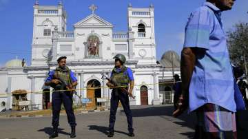 Soldiers stand guard in front of the St. Anthony's Shrine a day after the series of blasts, in Colombo, Sri Lanka.