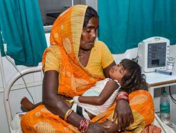 Muzaffarpur: A child showing symptoms of Acute Encephalitis Syndrome (AES) being treated at a hospital in Muzaffarpur