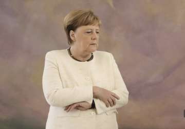 Germany Chancellor Angela Merkel seen trembling for second time in weeks at Berlin event