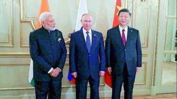 Prime Minister Narendra Modi, left, Russian President Vladimir Putin, center, and Chinese President Xi Jinping 