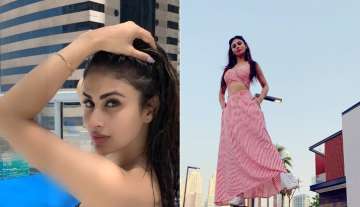 Mouni Roy enjoys summertime in a monochrome swimsuit, posing by the poolside