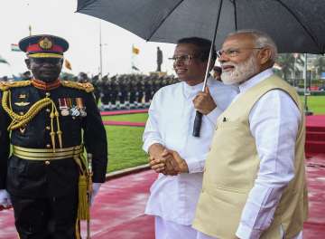Prime Minister Narendra Modi shakes hands with Sri Lankan President Maithripala Sirisena at a ceremonial reception, in Colombo