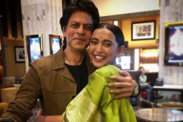 Sayani Gupta posing with Shah Rukh Khan on the screening of Article 15 in Mumbai