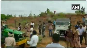 A grap from the video showing TRS leaders attacking the woman officer