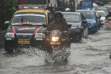 Heavy rain in Mumbai after dry spell; trains, road traffic hit