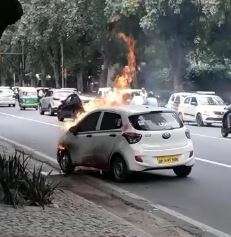 Video: Uber cab catches fire in New Delhi’s Ashoka road 