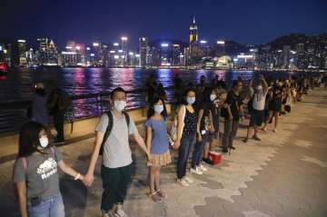Hong Kong protesters form human chains to call for democracy