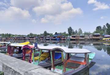 Shikaras stand parked on the Dal Lake in Srinagar, Thursday, Aug. 8, 2019.