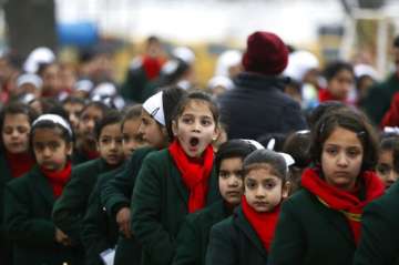 Kashmir schools open but students play shy