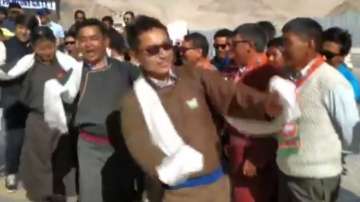 Attired in the traditional dark brown 'goucha' -- Ladakhi dress for men -- and donning dark sunglasses, Namgyal along with senior party leader Ram Madhav and others hoisted the Tricolour in Leh.