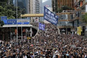 Hong Kong radical protesters throw petrol bombs
