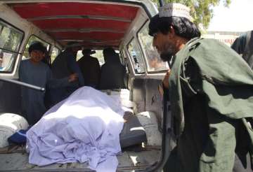 Afghans transport the body of a woman who was killed during a raid conducted by Afghan special forces, in the southern Helmand province, Monday, Sept. 23, 2019. An Afghan official said Monday that at least 40 civilians have been killed during an Afghan special forces raid and airstrikes conducted against of Taliban in southern Helmand province.
?