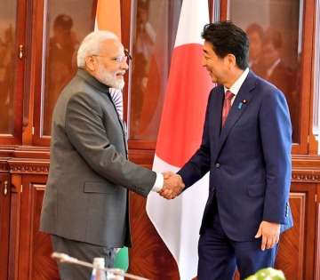 PM Modi meets Japanese PM Shinzo Abe in Russia