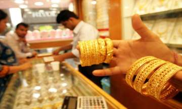 Firm domestic cues push gold futures up by Rs 147 per 10 gm