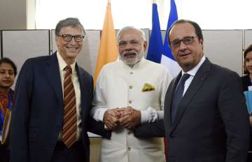 In this Sept. 28, 2015, file photo, from left, Microsoft CEO Bill Gates, and Indian Prime Minister Narendra Modi meet with French President Francois Hollande,