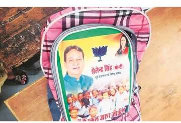 Delhi BJP leader's image on school bags; MCD issues notice