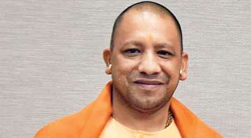 Yogi distributes land documents to Sonebhadra villagers