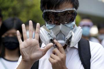 Thousands protest mask ban as Hong Kong leader toughens stance