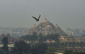 A view of Akshardham temple shrouded in heavy haze post-Diwali celebrations, in Delhi.