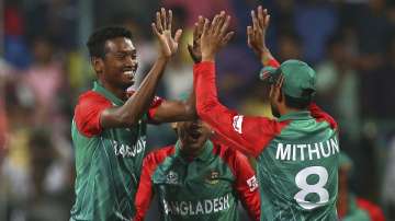 Al-Amin Hossain of Bangladesh celebrates after taking the wicket of Usman Khawaja of Australia during the ICC World Twenty20 India 2016 Super 10s Group 2 match between Australia and Bangladesh at M. Chinnaswamy Stadium