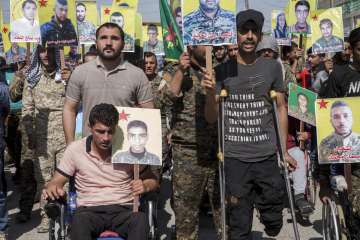 Wounded Kurdish fighters protest against Turkey's aggression.