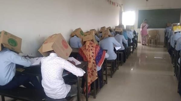 The boxes would act as blinders and the students won't cheat.