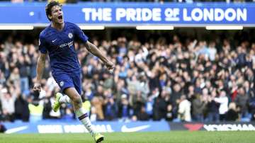 Chelsea's Marcos Alonso celebrates scoring his side's first goal during the British Premier League soccer match between Newcastle United and Chelsea, at Stamford Bridge, London, Saturday