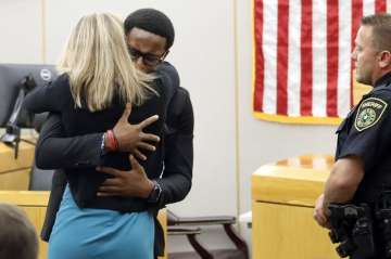 Video: Dallas Judge hugs slain man's brother in a never seen courtroom act