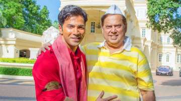 Varun Dhawan takes dad David Dhawan for a short scooter joy ride on the sets of Coolie no. 1