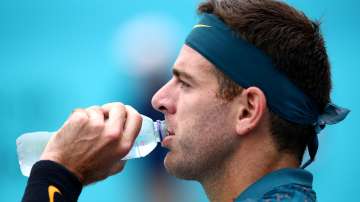 Juan Martin del Potro of Argentina takes a drink during his First Round Singles Match against Denis Shapovalov of Canada during day Three of the Fever-Tree Championships at Queens Club on June 19, 2019 in London