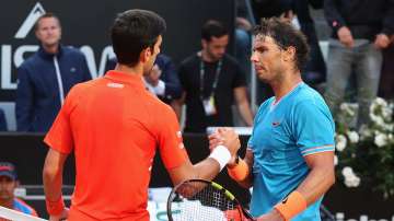 Rafael Nadal of Spain shakes the hands with Novak Djokovic of Serbia after winning the Men's singles final match during Day eight of the International BNL d'Italia at Foro Italico on May 19