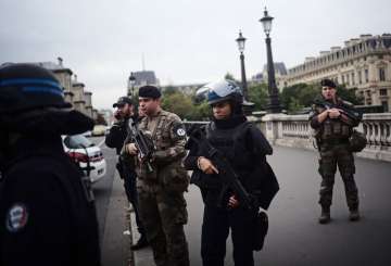 In knife attack, employee kills 4 officers at Paris police HQ