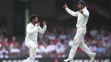 Kuldeep Yadav of India celebrates dismssing Travis Head of Australia during day three of the Fourth Test match in the series between Australia and India at Sydney Cricket Ground