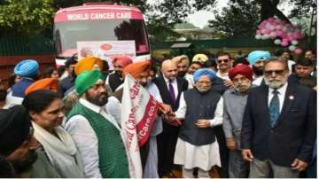 Ex-PM Manmohan Singh flags off 9 cancer detection vans 