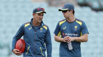 Travis Head of Australia speaks with Justin Langer, coach of Australia, during the Australia Net Session at The Kia Oval on September 11, 2019 in London, England.