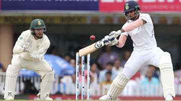 India's Umesh Yadav, right, bats during the second day of third and last cricket test match between India and South Africa in Ranchi. 