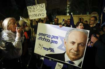 Supporters of Israeli Prime Minister Benjamin Netanyahu gather outside his residence in Jerusalem. I