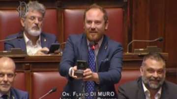 Italian lawmaker Flavio Di Muro proposes to girlfriend in Parliament