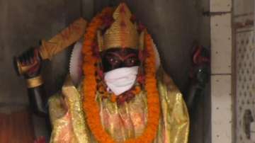 Anti-pollution masks save Gods from bad air at Varanasi temple.