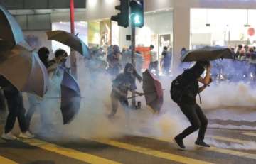 Hong Kong protesters vandalize subway station, storm mall