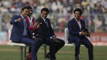 From right, India's former cricket players Sachin Tendulkar, Anil Kumble, Harbhajan Singh and V. V. S. Laxman join in a talk show during a break on the first day of the second test match between India and Bangladesh, in Kolkata