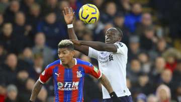 Crystal Palace's Patrick van Aanholt, left and Liverpool's Sadio Mane battle for the ball during the English Premier League soccer match between Crystal Palace and Liverpool
