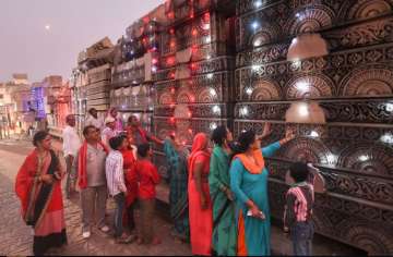 Ayodhya: People during a visit to the Shri Ram Janmbhoomi Nyas Karyashaala (workshop), a day after the Supreme Court's verdict on the Ayodhya case, in Ayodhya, Sunday, Nov.10, 2019.