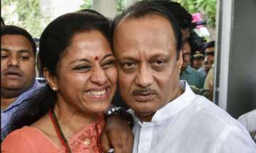 Postcards from India: (Mumbai) NCP leaders Supriya Sule and Ajit Pawar hug during a special session of Maharashtra Assembly, at Vidhan Bhawan in Mumbai, Wednesday, Nov. 27, 2019. (PTI Photo)