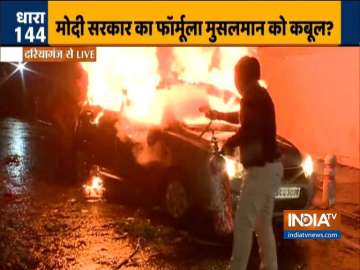 Protestors set vehicle on fire in Daryaganj, cops use water cannon