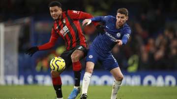 Bournemouth's Joshua King, left, duels for the ball with Chelsea's Jorginho during the English Premier League soccer match between Chelsea and Bournemouth