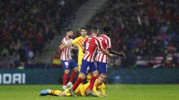 FC Barcelona's Antoine Griezmann falls during a Spanish La Liga soccer match between Atletico Madrid and FC Barcelona at Wanda Metropolitano stadium in Madrid