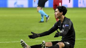 Salzburg's Takumi Minamino reacts during the group E Champions League soccer match between Salzburg and Liverpool, in Salzburg, Austria