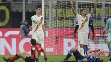 Inter Milan's Stefan de Vrij, right, on the ground after colliding with referee Gianpaolo Calvarese , left, on the ground during a Serie A soccer match between Inter Milan and Roma